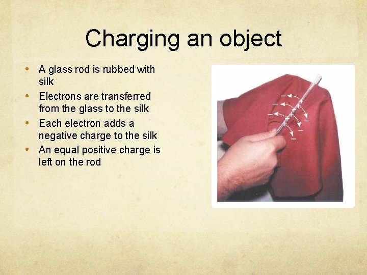 Charging an object • A glass rod is rubbed with • • • silk