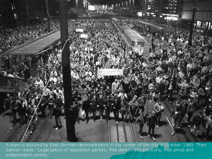 A tram is blocked by East German demonstrators in the center of the city