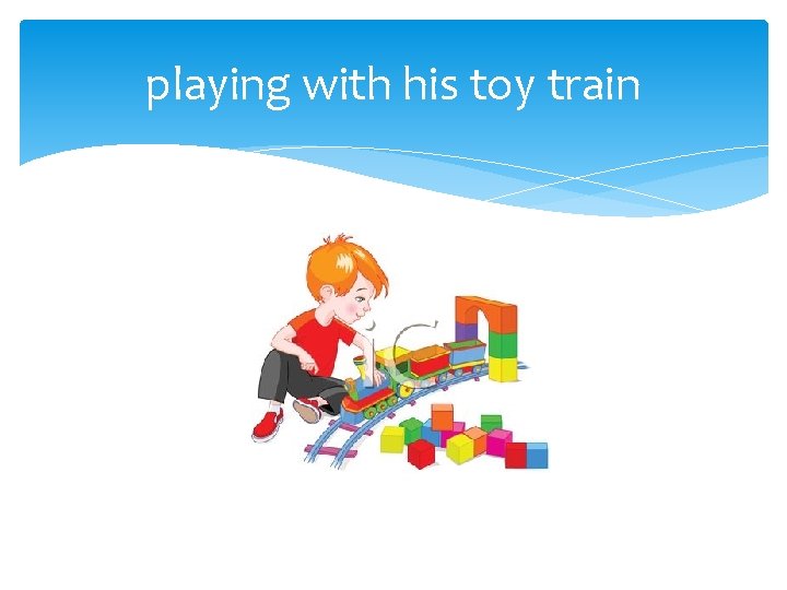 playing with his toy train 