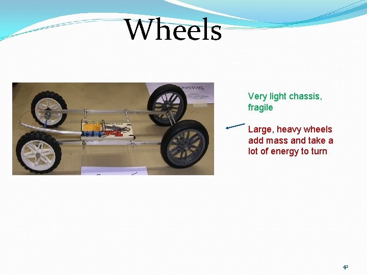 Wheels Very light chassis, fragile Large, heavy wheels add mass and take a lot