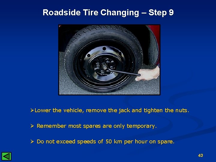 Roadside Tire Changing – Step 9 ØLower the vehicle, remove the jack and tighten