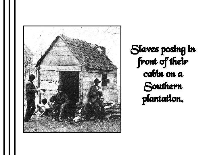 Slaves posing in front of their cabin on a Southern plantation. 