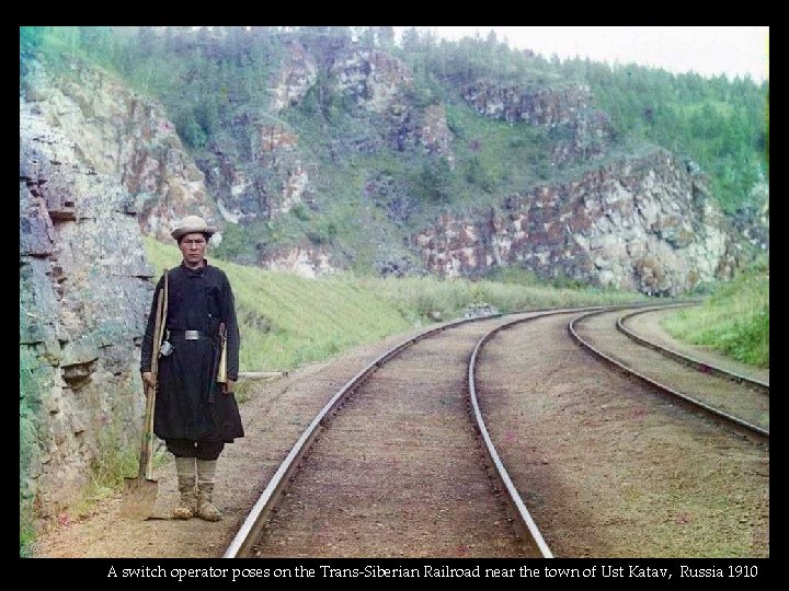 A switch operator poses on the Trans-Siberian Railroad near the town of Ust Katav,