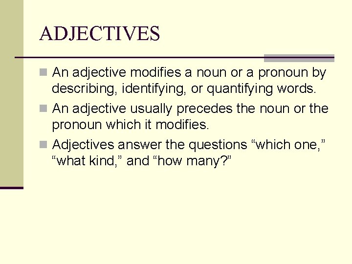 ADJECTIVES n An adjective modifies a noun or a pronoun by describing, identifying, or