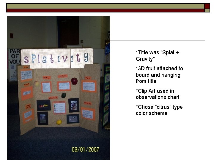 *Title was “Splat + Gravity” *3 D fruit attached to board and hanging from