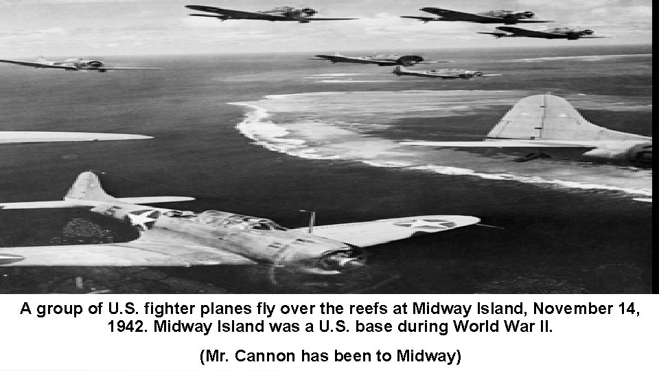 A group of U. S. fighter planes fly over the reefs at Midway Island,