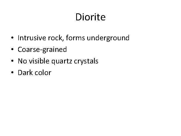 Diorite • • Intrusive rock, forms underground Coarse-grained No visible quartz crystals Dark color