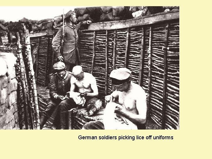 German soldiers picking lice off uniforms 