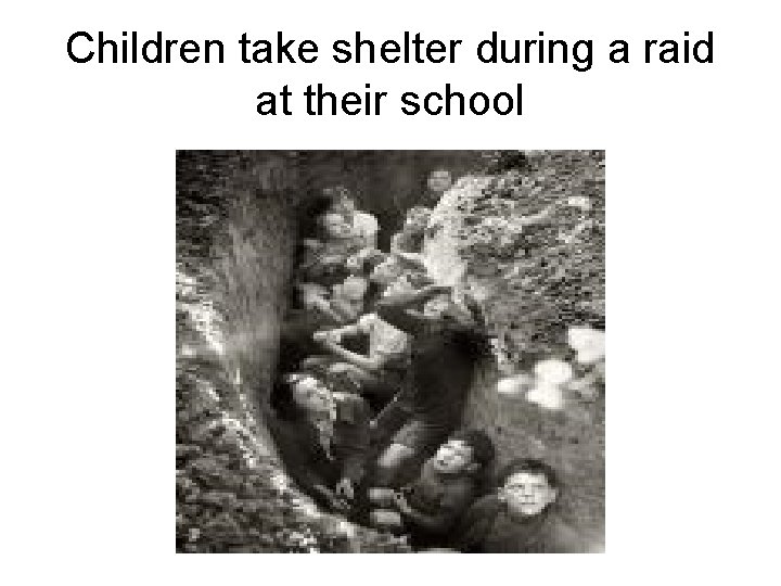Children take shelter during a raid at their school 