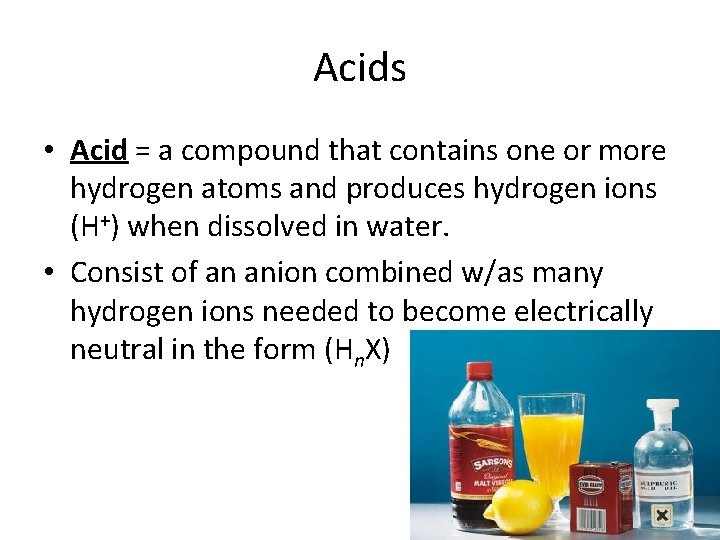 Acids • Acid = a compound that contains one or more hydrogen atoms and