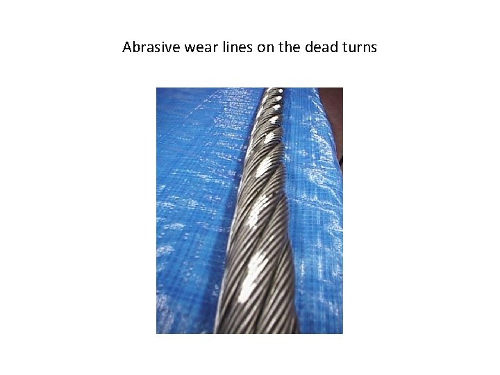 Abrasive wear lines on the dead turns 