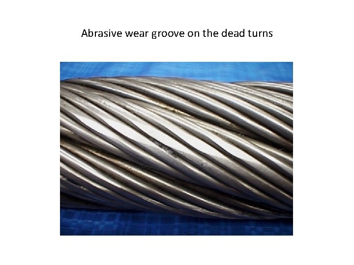 Abrasive wear groove on the dead turns 