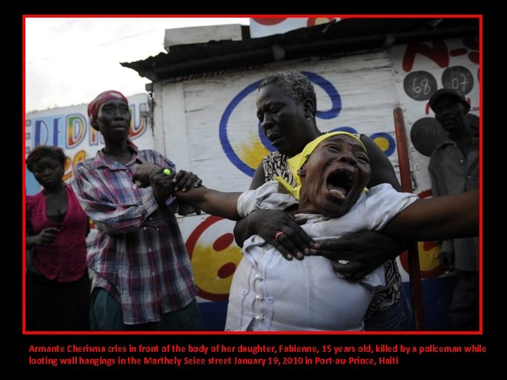 Armante Cherisma cries in front of the body of her daughter, Fabienne, 15 years