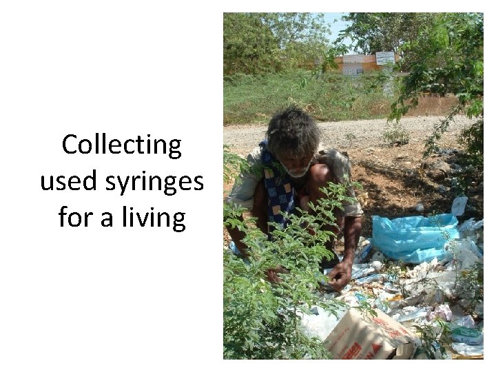 Collecting used syringes for a living 