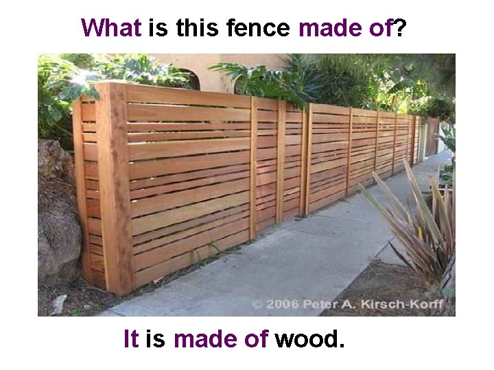 What is this fence made of? It is made of wood. 