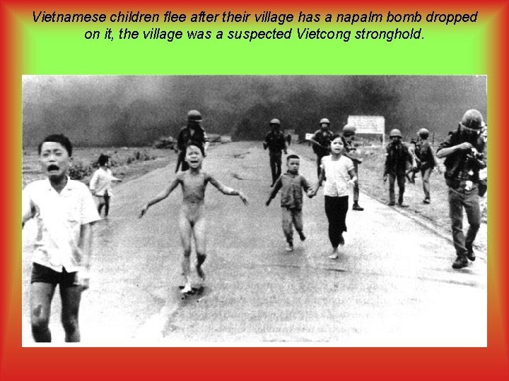 Vietnamese children flee after their village has a napalm bomb dropped on it, the