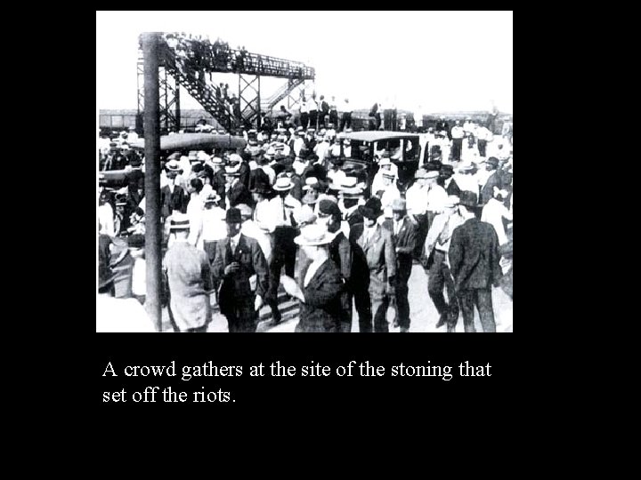 A crowd gathers at the site of the stoning that set off the riots. A crowd gathers at the site of the stoning that set off the riots.