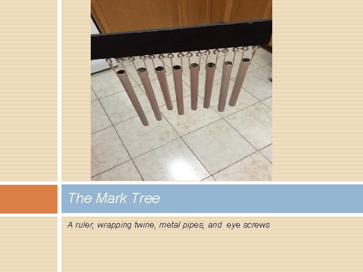 The Mark Tree A ruler, wrapping twine, metal pipes, and eye screws 