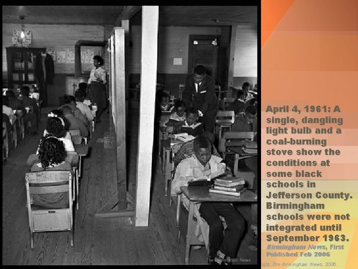 April 4, 1961: A single, dangling light bulb and a coal-burning stove show the