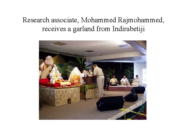 Research associate, Mohammed Rajmohammed, receives a garland from Indirabetiji 