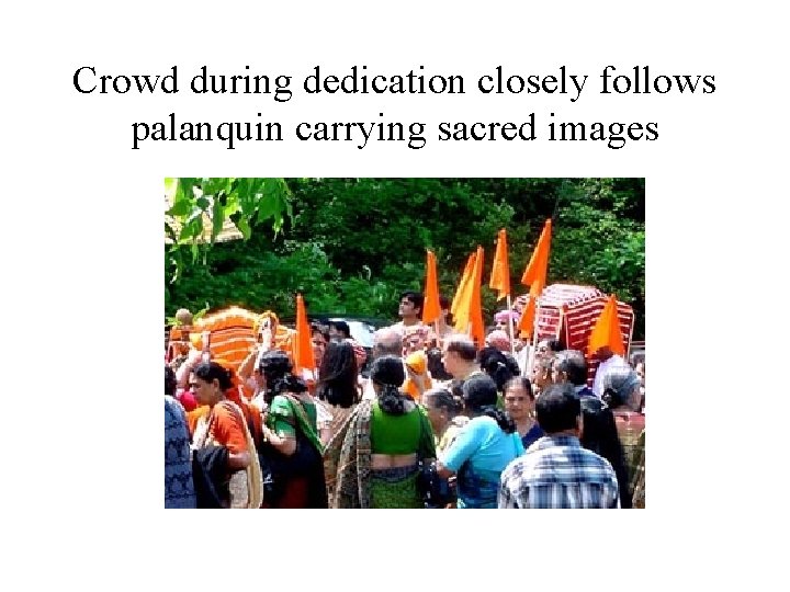 Crowd during dedication closely follows palanquin carrying sacred images 