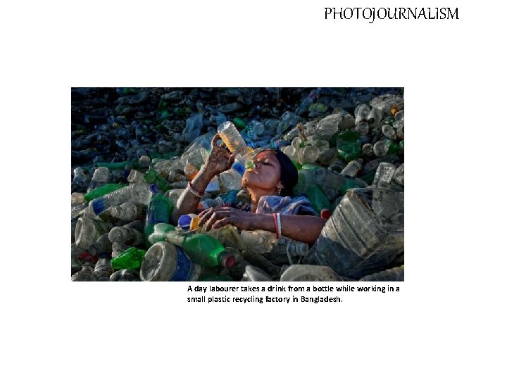 PHOTOJOURNALISM A day labourer takes a drink from a bottle while working in a