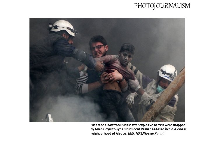 PHOTOJOURNALISM Men free a boy from rubble after explosive barrels were dropped by forces