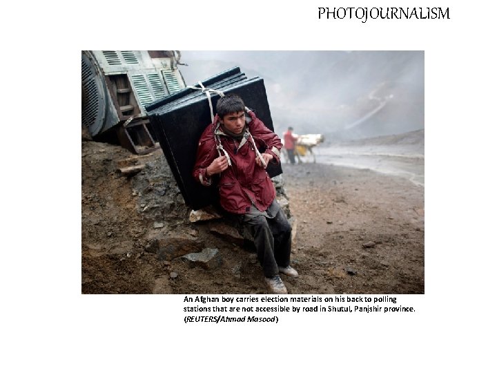 PHOTOJOURNALISM An Afghan boy carries election materials on his back to polling stations that