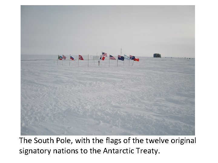 The South Pole, with the flags of the twelve original signatory nations to the