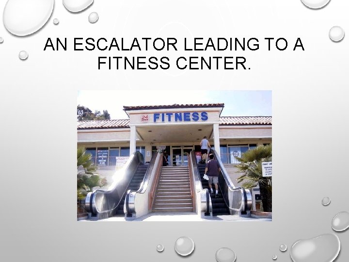 AN ESCALATOR LEADING TO A FITNESS CENTER. 