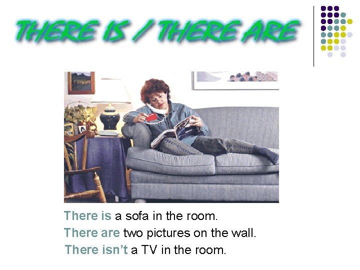 There is a sofa in the room. There are two pictures on the wall.