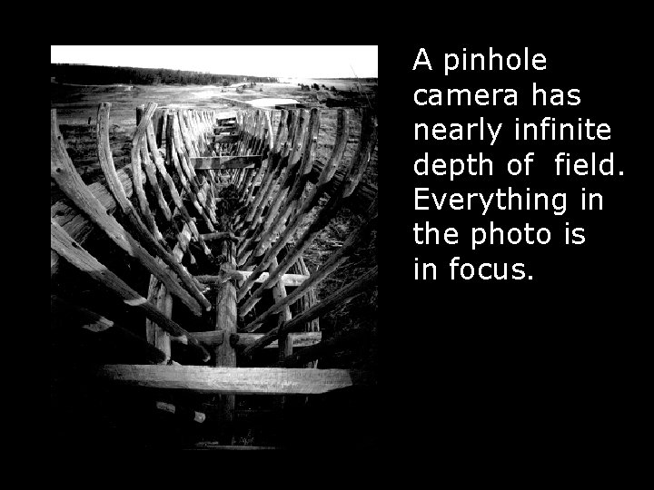 A pinhole camera has nearly infinite depth of field. Everything in the photo is