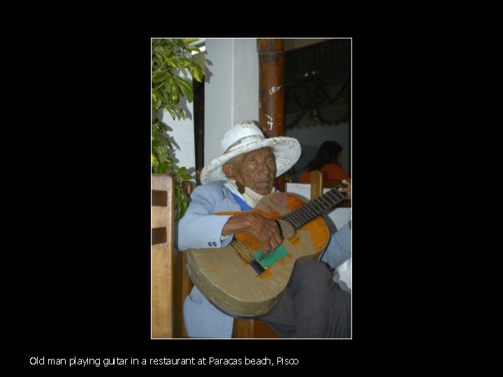 Old man playing guitar in a restaurant at Paracas beach, Pisco 