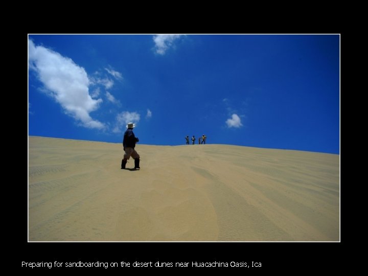 Preparing for sandboarding on the desert dunes near Huacachina Oasis, Ica 