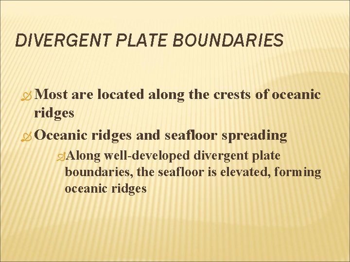 DIVERGENT PLATE BOUNDARIES Most are located along the crests of oceanic ridges Oceanic ridges