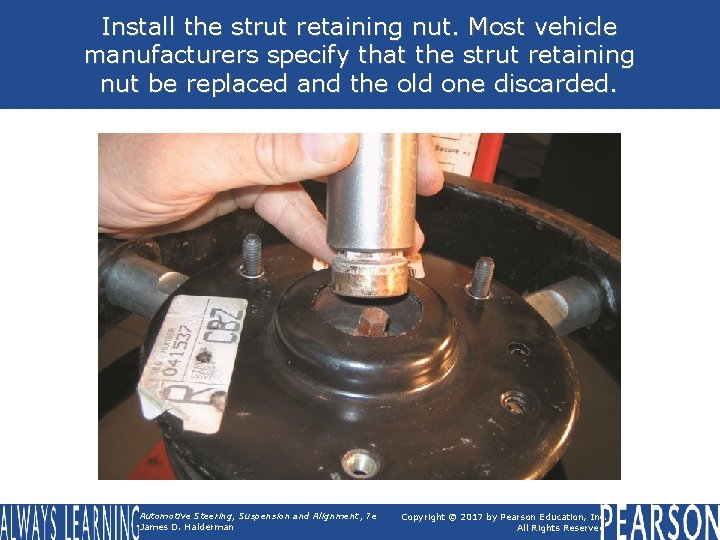 Install the strut retaining nut. Most vehicle manufacturers specify that the strut retaining nut