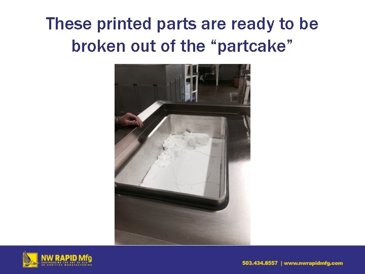 These printed parts are ready to be broken out of the “partcake” 