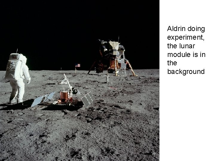 Aldrin doing experiment, the lunar module is in the background 