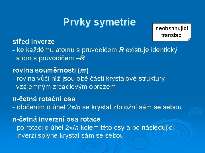 Prvky symetrie neobsahující translaci střed inverze - ke každému atomu s průvodičem R existuje