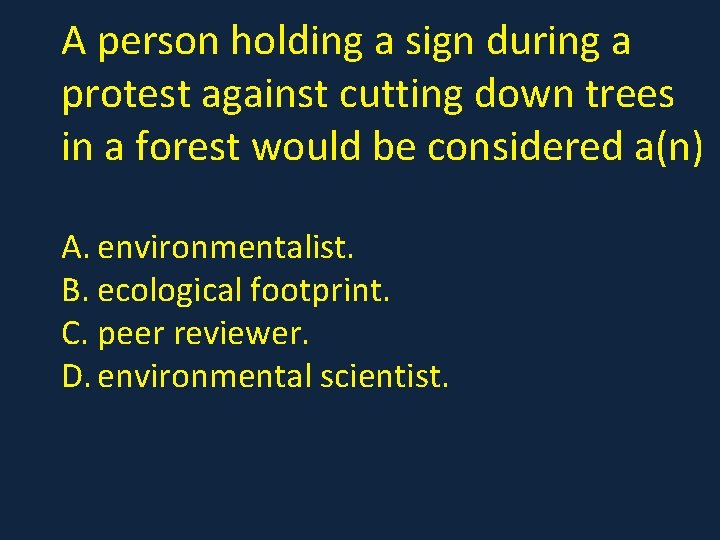 A person holding a sign during a protest against cutting down trees in a
