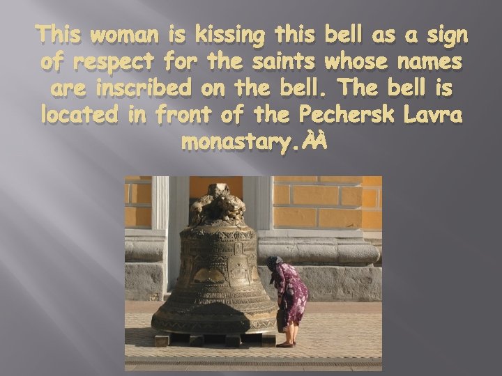 This woman is kissing this bell as a sign of respect for the saints