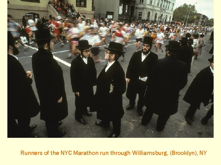 Runners of the NYC Marathon run through Williamsburg, (Brooklyn), NY 