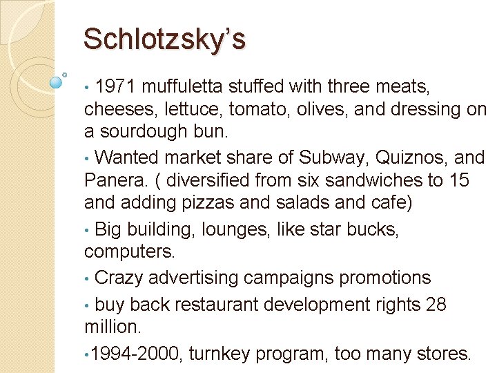 Schlotzsky’s 1971 muffuletta stuffed with three meats, cheeses, lettuce, tomato, olives, and dressing on