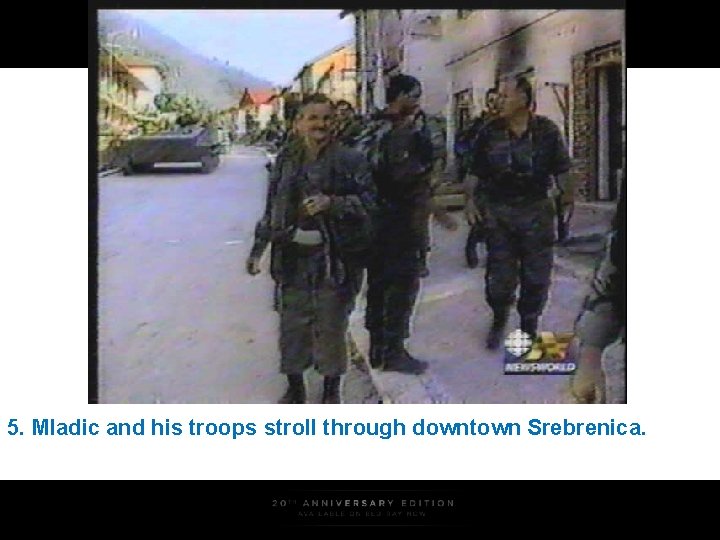 5. Mladic and his troops stroll through downtown Srebrenica. 