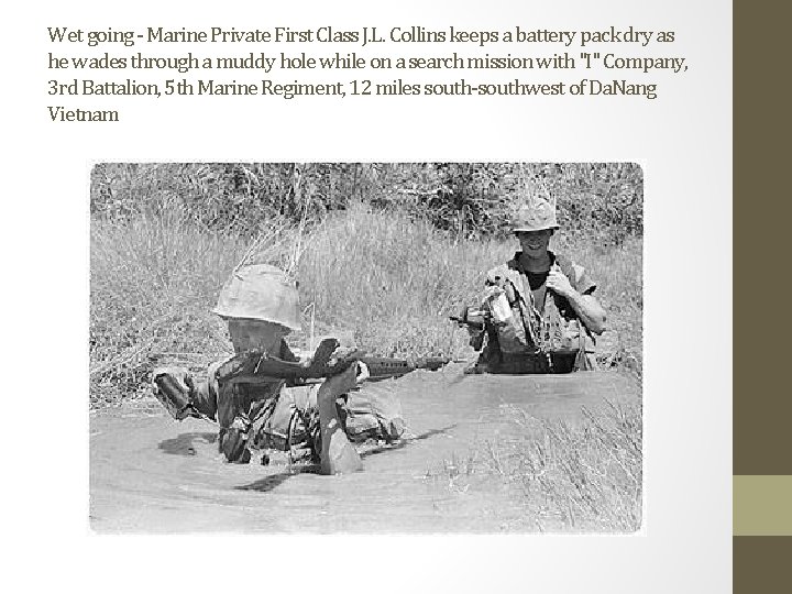 Wet going - Marine Private First Class J. L. Collins keeps a battery pack