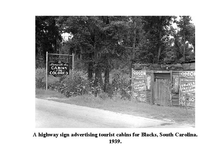 A highway sign advertising tourist cabins for Blacks, South Carolina. 1939. 