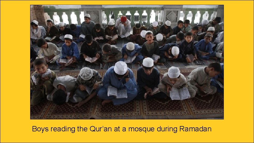Boys reading the Qur’an at a mosque during Ramadan 