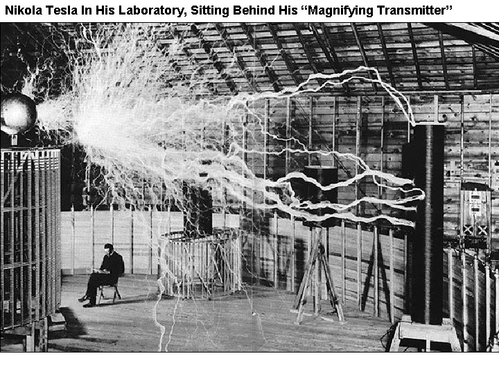 Nikola Tesla In His Laboratory, Sitting Behind His “Magnifying Transmitter” 