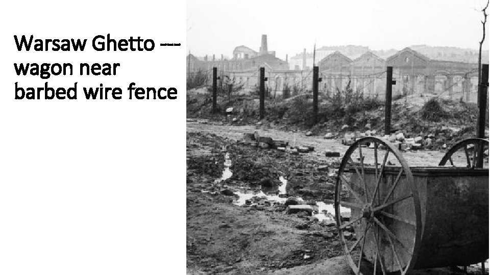 Warsaw Ghetto --wagon near barbed wire fence 