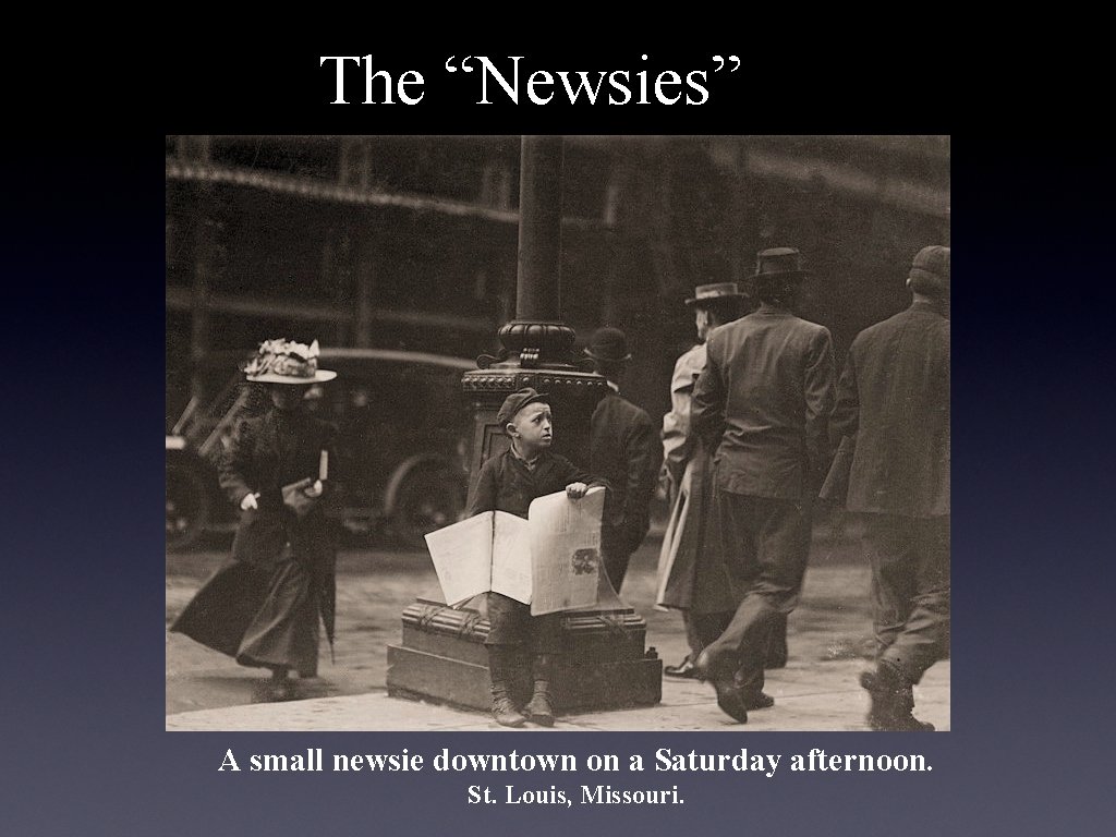 The “Newsies” A small newsie downtown on a Saturday afternoon. St. Louis, Missouri. 